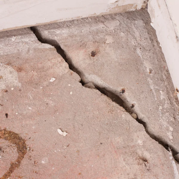 An image representing safety hazards from cracked foundation concrete.